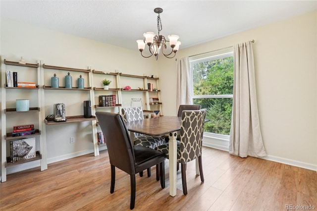 7305 S Xenia Cir Unit E, Centennial, CO 80112 - dining area featuring a chandelier and light wood finished floors