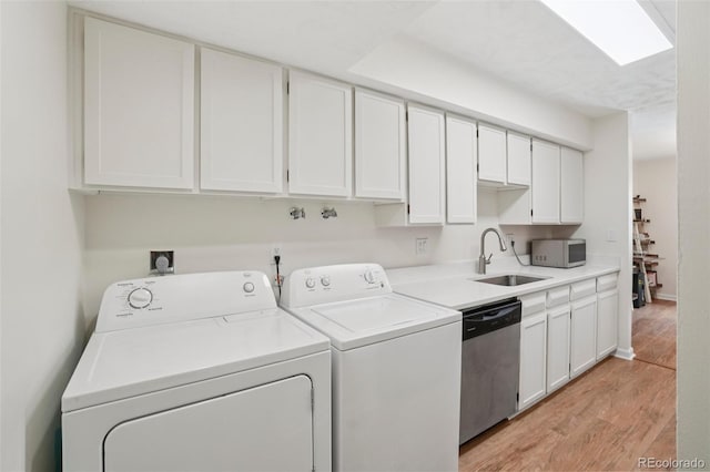 7305 S Xenia Cir Unit E, Centennial, CO 80112 - laundry area with washing machine and clothes dryer and light wood-style flooring