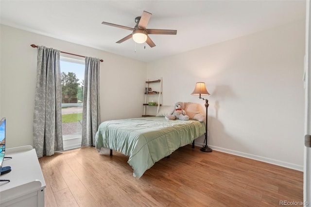 7305 S Xenia Cir Unit E, Centennial, CO 80112 - bedroom featuring light wood finished floors and a ceiling fan