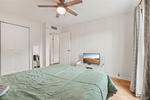 7305 S Xenia Cir Unit E, Centennial, CO 80112 - bedroom with wood finished floors, a closet, and ceiling fan