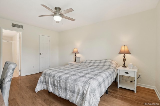 7305 S Xenia Cir Unit E, Centennial, CO 80112 - bedroom featuring wood finished floors and ceiling fan