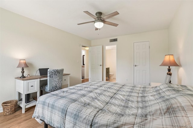 7305 S Xenia Cir Unit E, Centennial, CO 80112 - bedroom with light wood-style flooring, connected bathroom, and ceiling fan