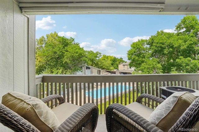 7305 S Xenia Cir Unit E, Centennial, CO 80112 - balcony featuring view of pool