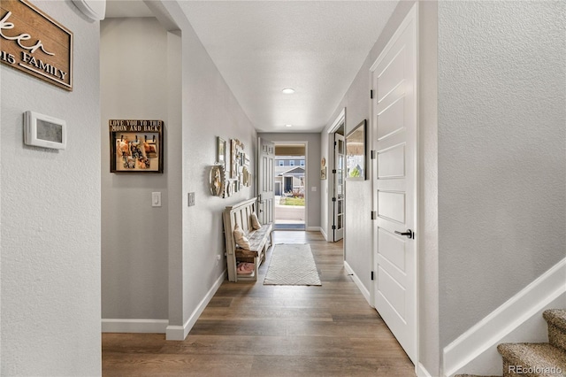 2576 Villageview Ln, Castle Rock, CO 80104 - entrance foyer featuring wood finished floors, a textured wall, baseboards, stairway, and recessed lighting