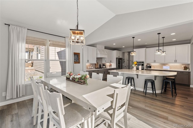 2576 Villageview Ln, Castle Rock, CO 80104 - dining space with vaulted ceiling, a chandelier, wood finished floors, and recessed lighting