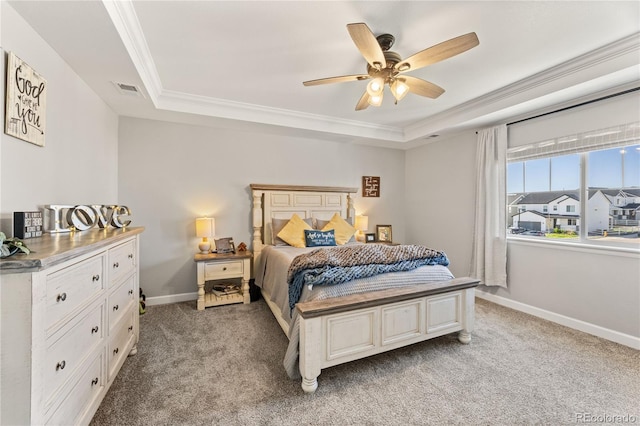 2576 Villageview Ln, Castle Rock, CO 80104 - bedroom with a tray ceiling, crown molding, light carpet, baseboards, and a ceiling fan