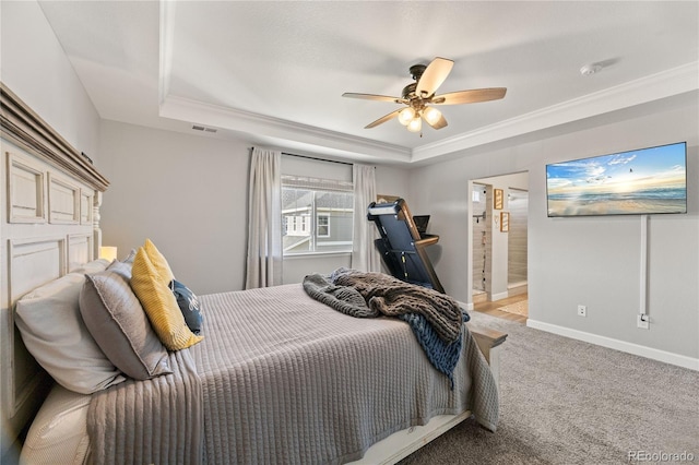 2576 Villageview Ln, Castle Rock, CO 80104 - carpeted bedroom featuring a raised ceiling, ornamental molding, baseboards, a ceiling fan, and ensuite bath