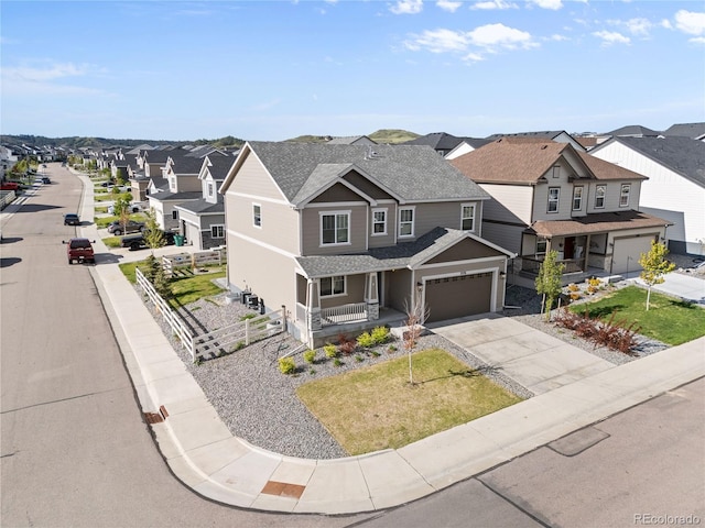 2576 Villageview Ln, Castle Rock, CO 80104 - view of front of home featuring a porch, a residential view, driveway, and roof with shingles