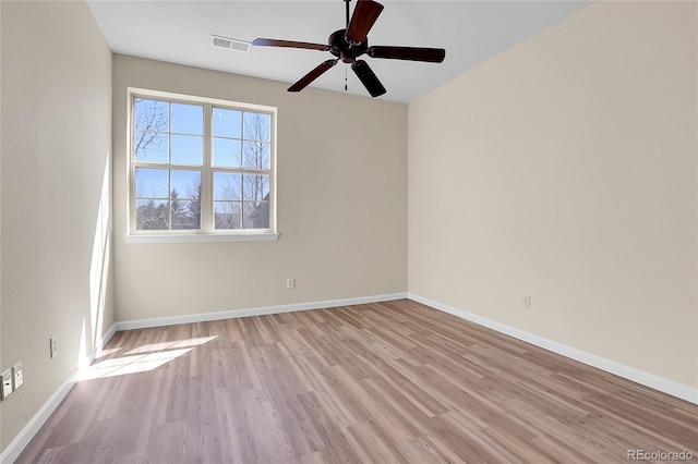 1194 Red Lodge Dr Unit 201, Evergreen, CO 80439 - unfurnished room with baseboards, ceiling fan, light wood-type flooring, and visible vents