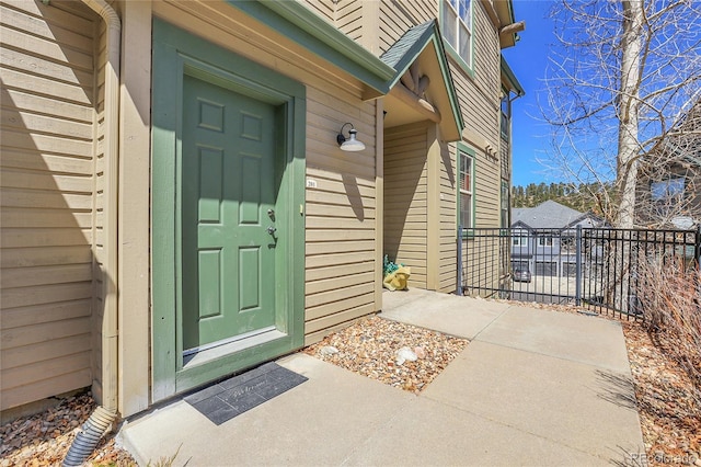 1194 Red Lodge Dr Unit 201, Evergreen, CO 80439 - view of exterior entry featuring fence