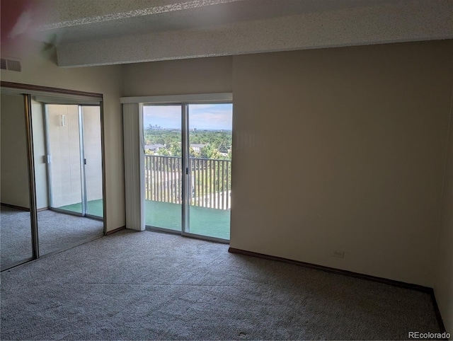 8060 E Girard Ave Unit 910, Denver, CO 80231 - spare room featuring carpet flooring and baseboards