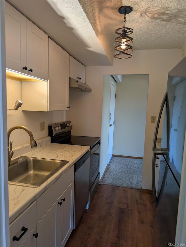 8060 E Girard Ave Unit 910, Denver, CO 80231 - kitchen with stainless steel appliances, under cabinet range hood, dark wood finished floors, white cabinets, and a textured ceiling