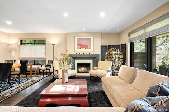 2800 S University Blvd Unit 19, Denver, CO 80210 - living area featuring a warm lit fireplace, wood finished floors, and recessed lighting