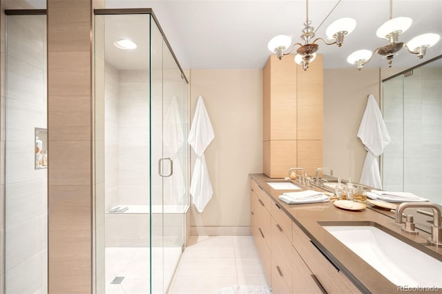 2800 S University Blvd Unit 19, Denver, CO 80210 - bathroom with double vanity, tile patterned floors, a shower stall, and a chandelier