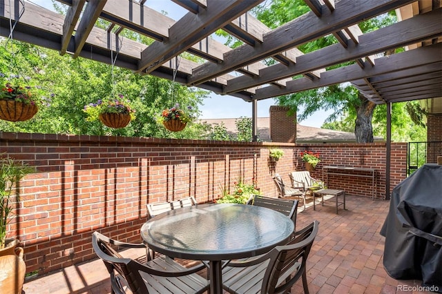 2800 S University Blvd Unit 19, Denver, CO 80210 - view of patio featuring a pergola, outdoor dining space, and area for grilling