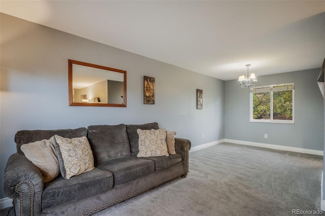 living room with an inviting chandelier and carpet floors