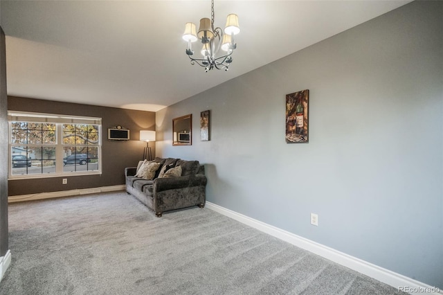 living room featuring carpet and a chandelier