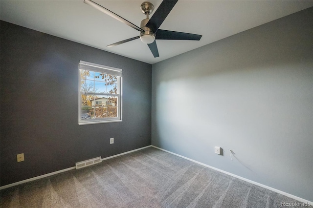 unfurnished room featuring ceiling fan and carpet