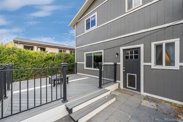 doorway to property featuring a wooden deck