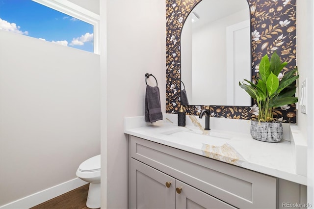 2010 Irving St, Denver, CO 80211 - half bathroom featuring vanity and wood finished floors