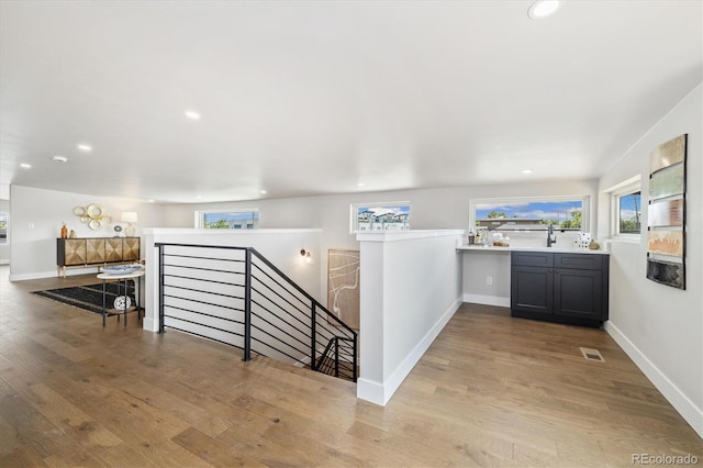 2010 Irving St, Denver, CO 80211 - hall featuring an upstairs landing, wood finished floors, and recessed lighting