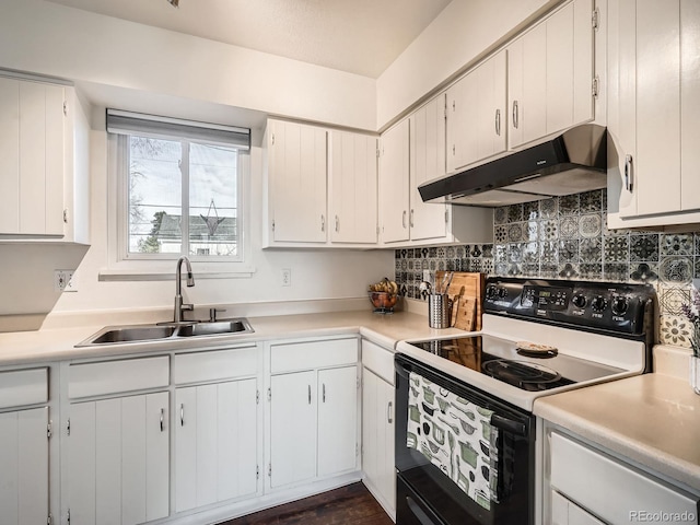 kitchen with range with electric cooktop, light countertops, a sink, and under cabinet range hood