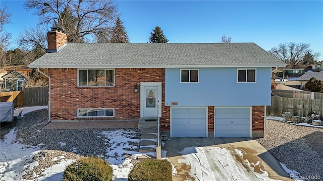 bi-level home featuring a garage