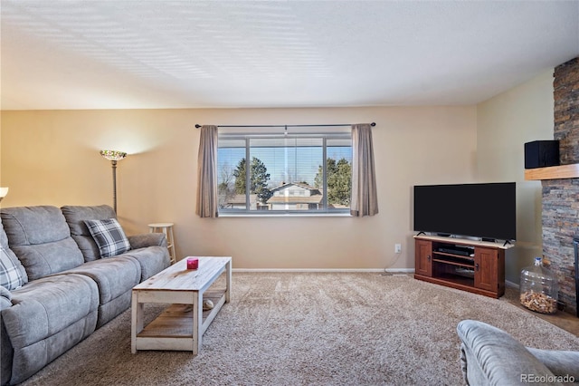 living room featuring light carpet and a fireplace