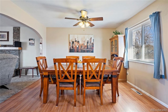 dining space featuring light hardwood / wood-style floors and ceiling fan