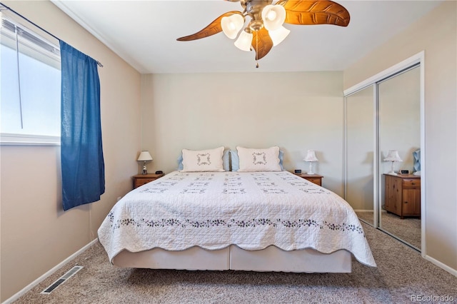 bedroom featuring a closet, ceiling fan, and carpet flooring