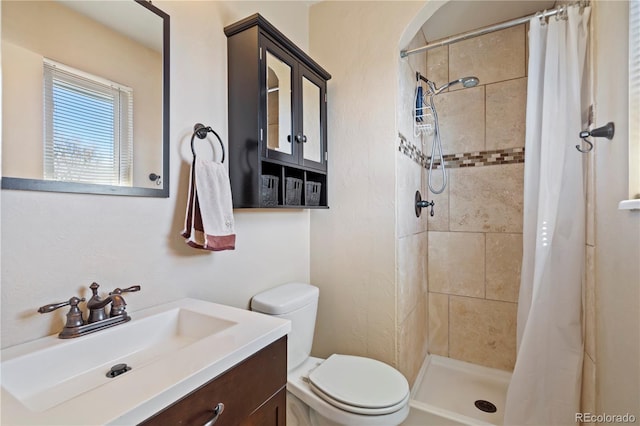 bathroom featuring vanity, a shower with curtain, and toilet