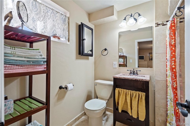 bathroom with vanity and toilet