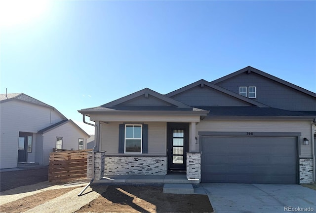 view of front of property with a garage and a porch