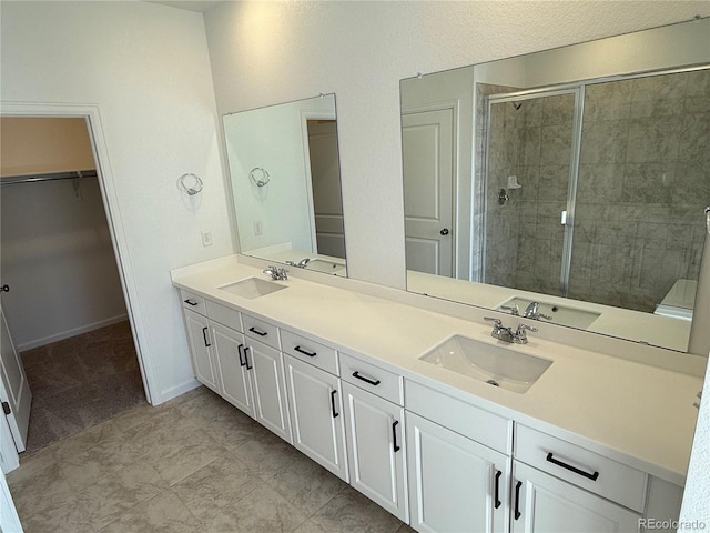 bathroom with vanity and an enclosed shower