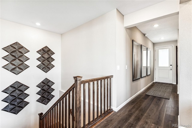 hallway with dark wood-type flooring