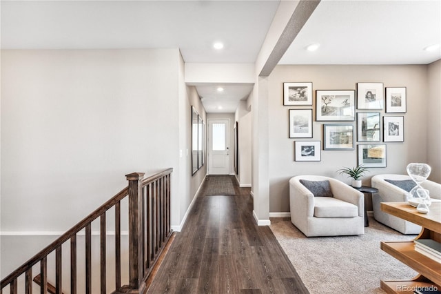 hallway with dark hardwood / wood-style floors