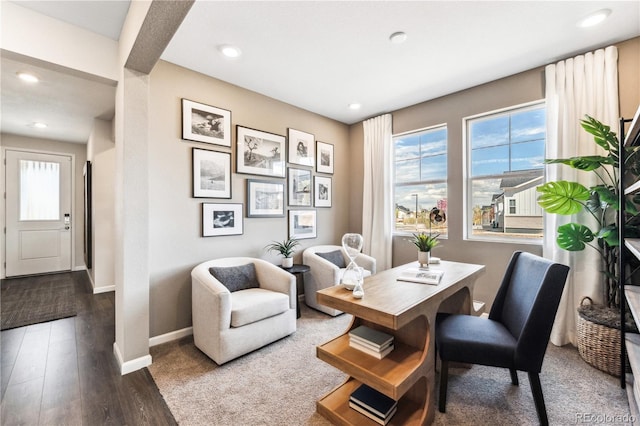 living area with hardwood / wood-style floors