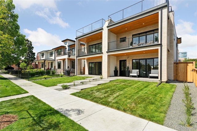1647 N Osceola St, Denver, CO 80204 - rear view of house featuring a balcony and brick siding