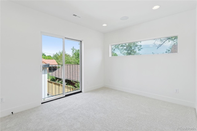 1647 N Osceola St, Denver, CO 80204 - carpeted spare room featuring baseboards and recessed lighting