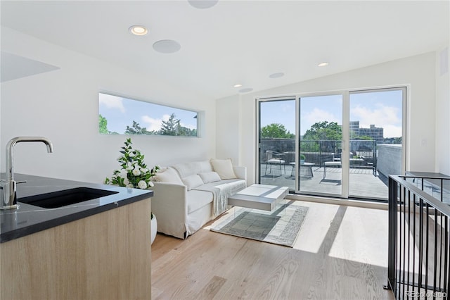 1647 N Osceola St, Denver, CO 80204 - living area with light wood-type flooring, lofted ceiling, and recessed lighting