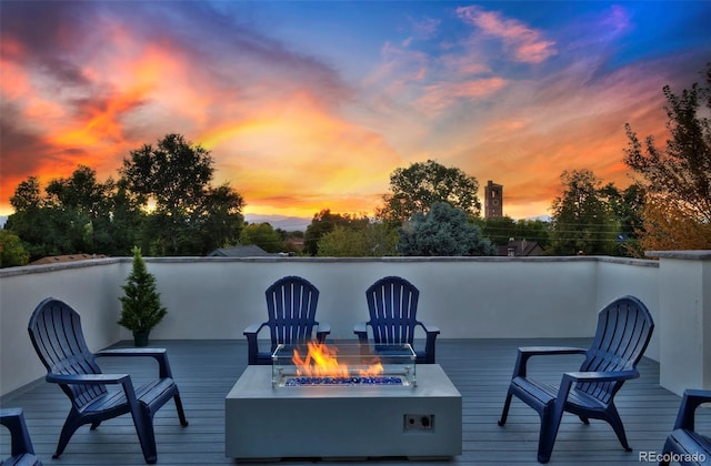 wooden deck featuring a fire pit