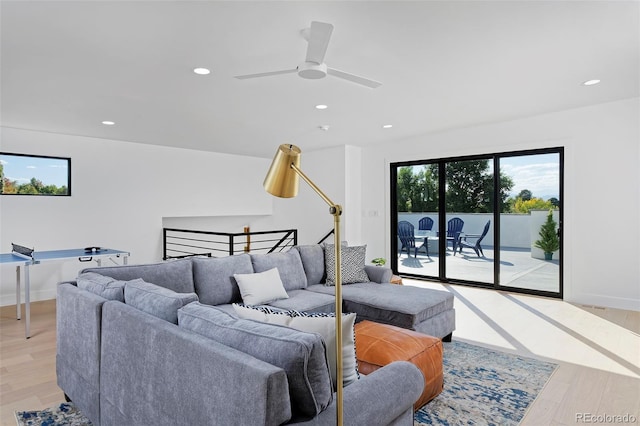 living room featuring light wood-style flooring, recessed lighting, and ceiling fan