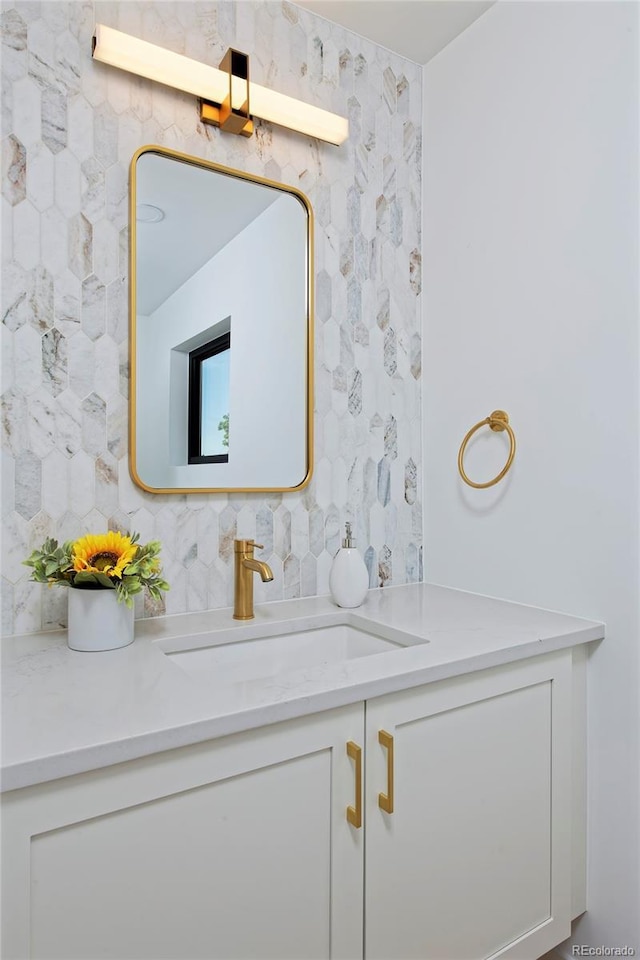 bathroom with backsplash and vanity