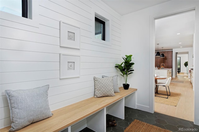 mudroom featuring recessed lighting and dark tile patterned flooring