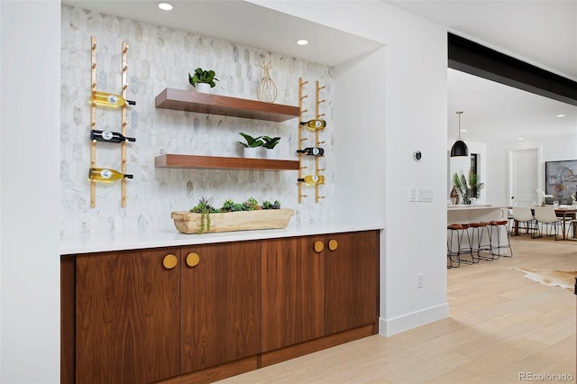 bar with recessed lighting and light wood-type flooring