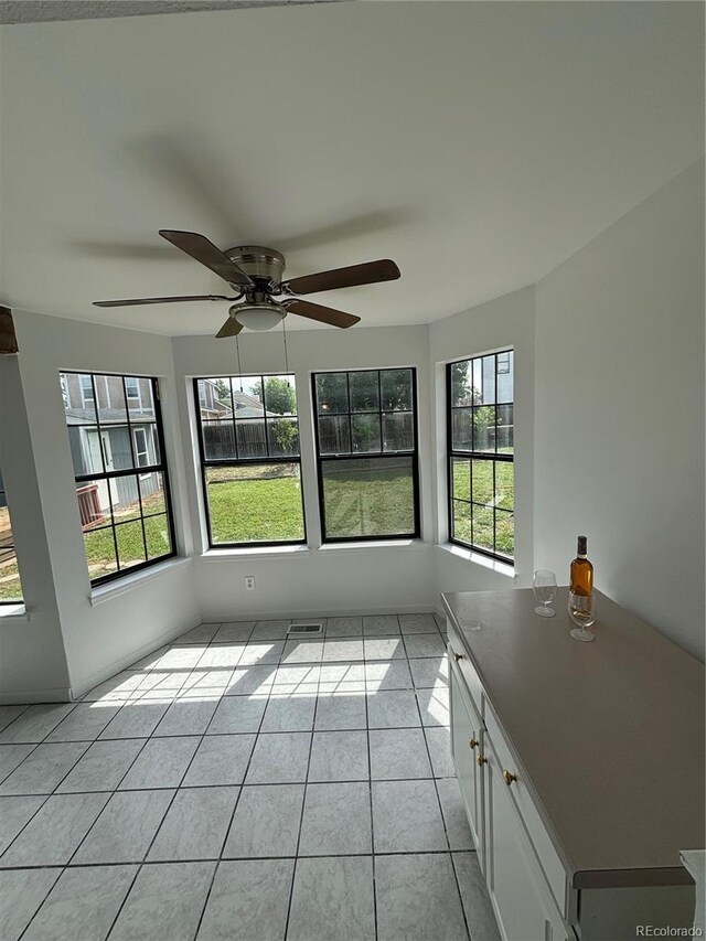 4362 Denmark Ct, Denver, CO 80239 - unfurnished sunroom with plenty of natural light