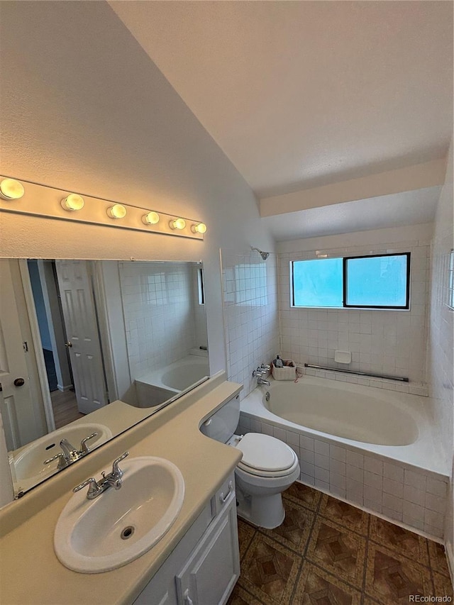 4362 Denmark Ct, Denver, CO 80239 - full bathroom with vanity, vaulted ceiling, and tiled shower / bath