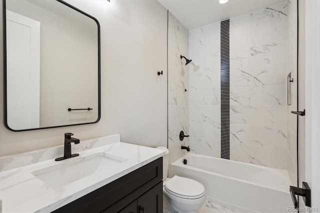 full bathroom featuring vanity, toilet, and tiled shower / bath