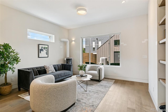 2403 S Cherokee St, Denver, CO 80223 - living area with wood finished floors and healthy amount of natural light