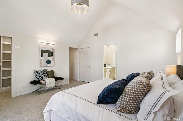 2403 S Cherokee St, Denver, CO 80223 - bedroom with light colored carpet, high vaulted ceiling, and ensuite bath